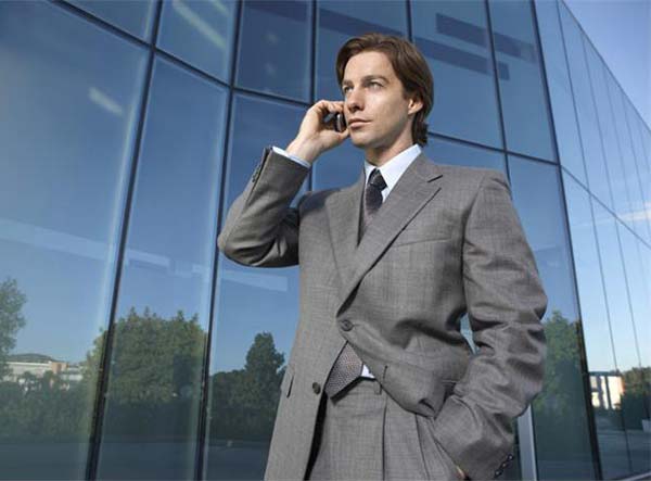 businessman-talks-mobile-phone