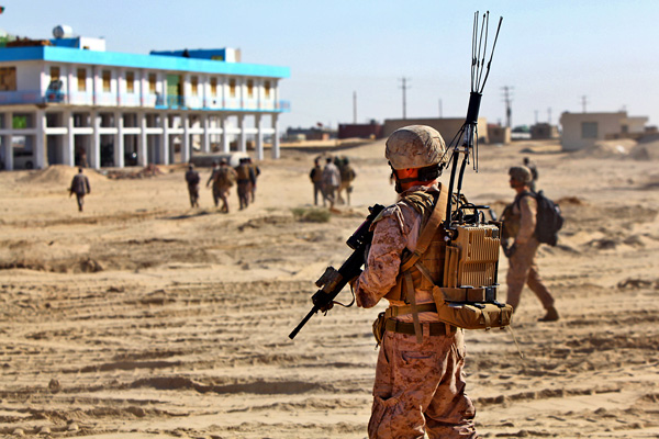 American soldier with jammer in backpack