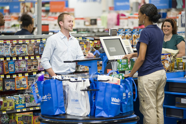 Man at checkout counter of the Walmart store