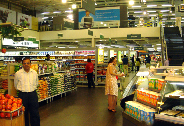 Woman with smartphone in shopping mall