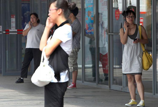 People with mobile phones in Beijing