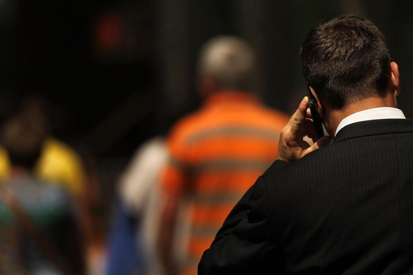 Guy walking with cell phone